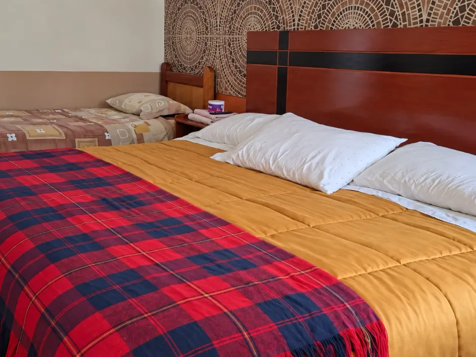 Close view of the two beds in the family suite at Hotel Manantial, Churín